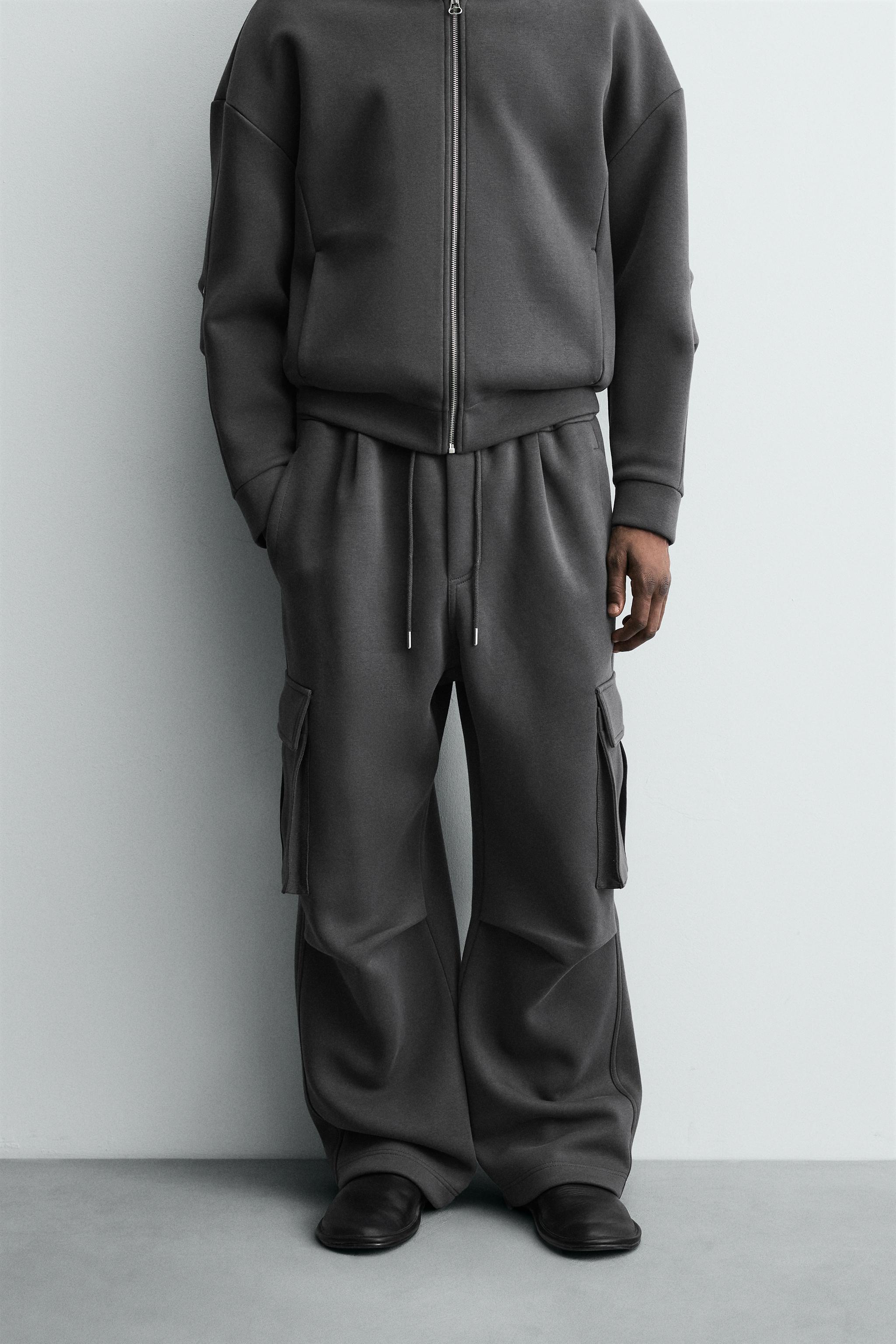 NEOPRENE EFFECT CARGO PANTS WITH PLEATS